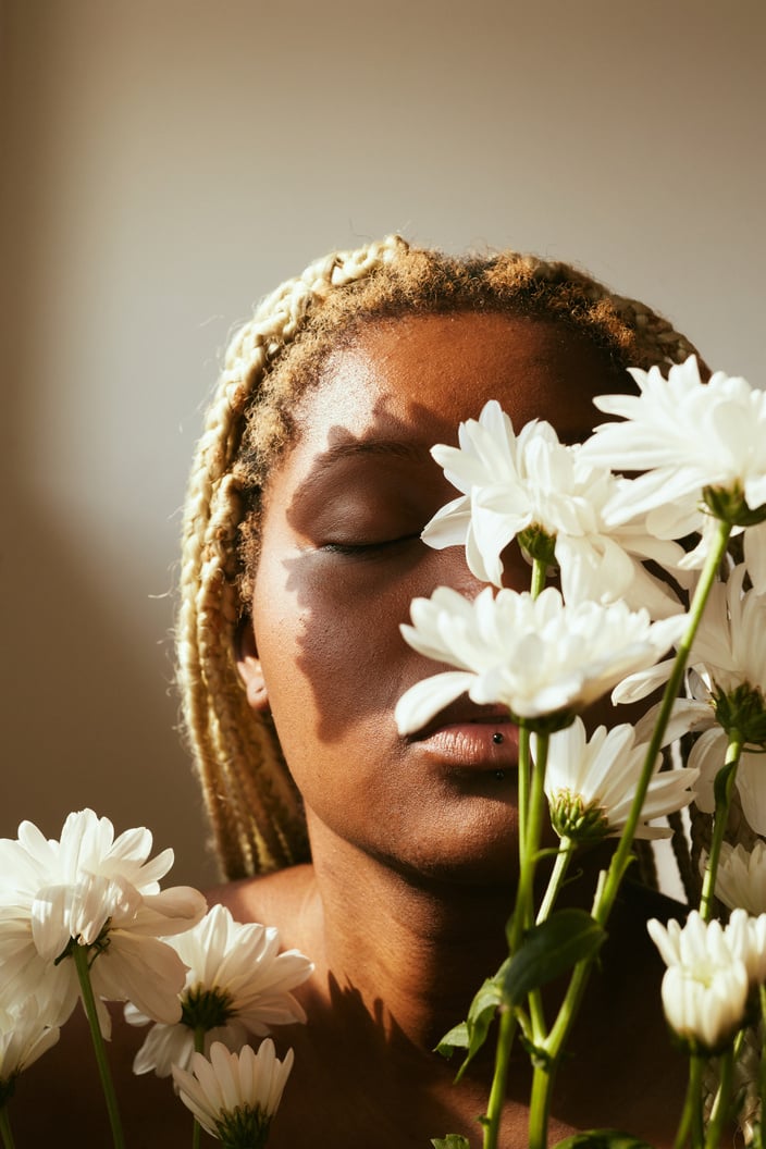 Portrait of Woman with Flowers and Dramatic Lighting