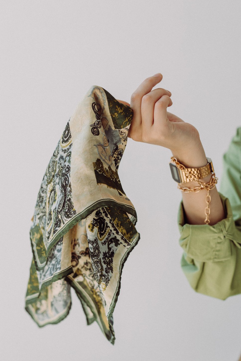 Woman Holding Green Scarf